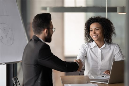 woman shakes hand recruitment