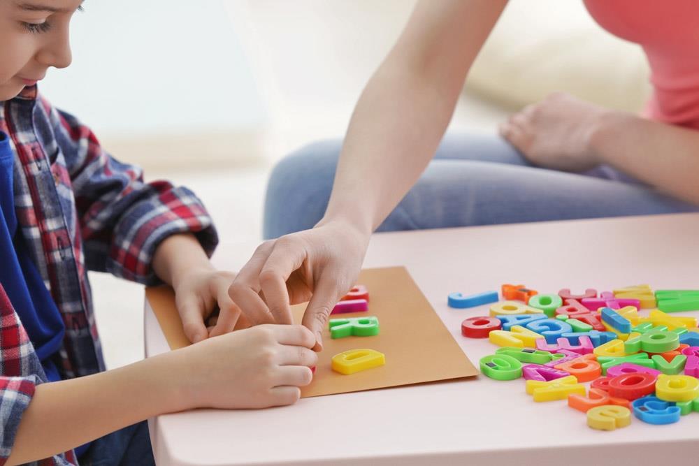 photo cute little boy at speech therapist office